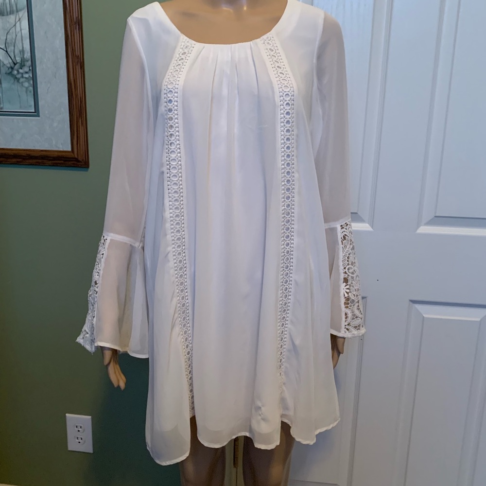 White babydoll dress with embroidered lace detail